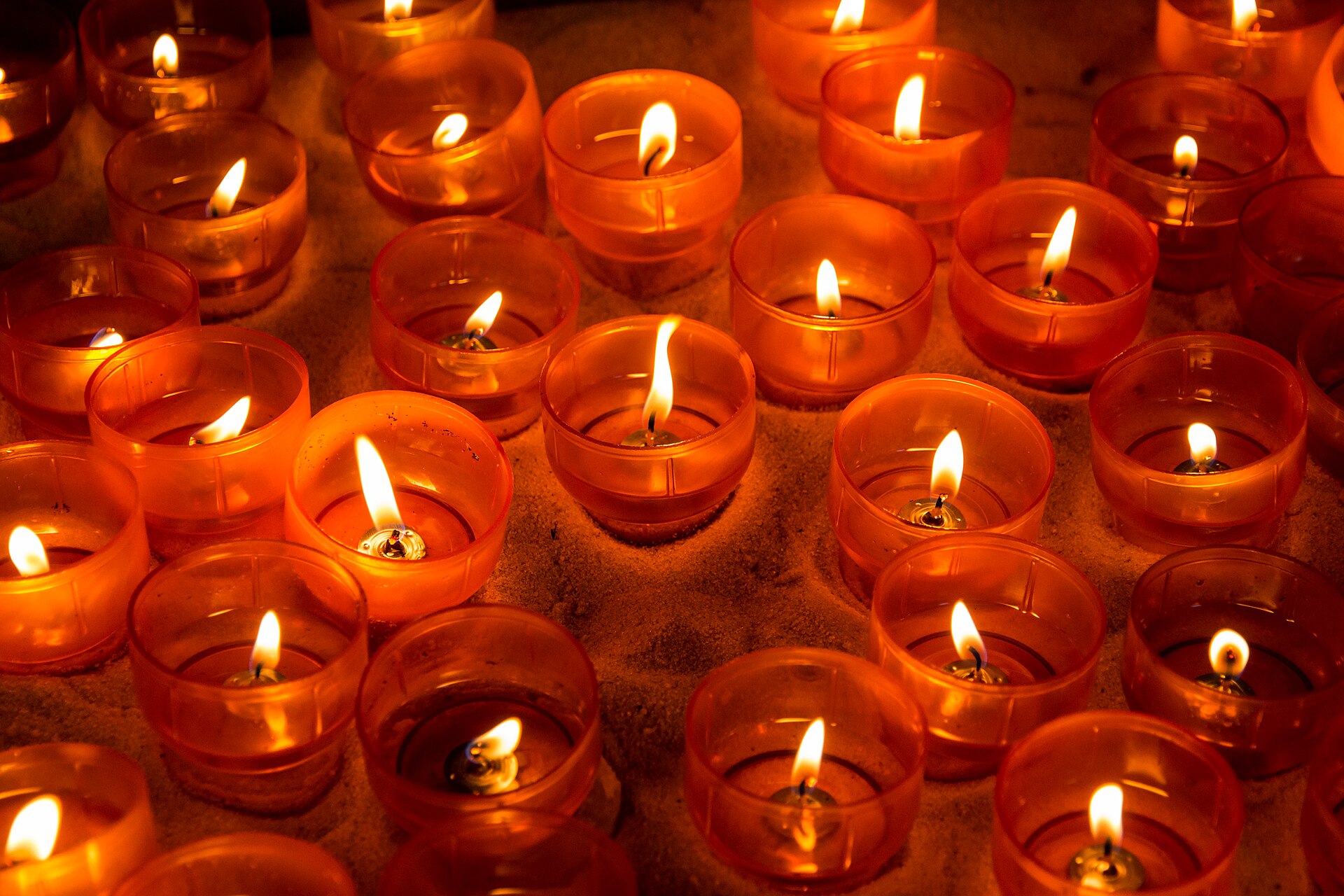 Votive candles glowing in a church